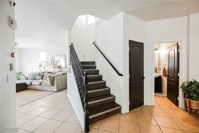 staircase with tile patterned flooring