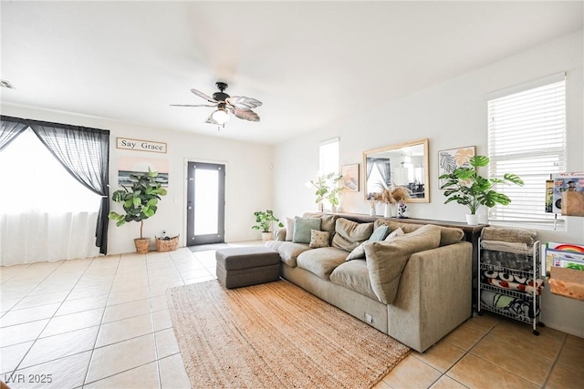 living room featuring ceiling fan and light tile patterned floors