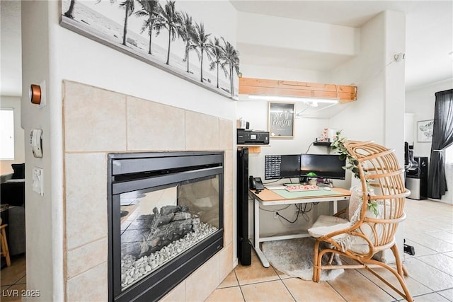 kitchen featuring light tile patterned floors and a fireplace