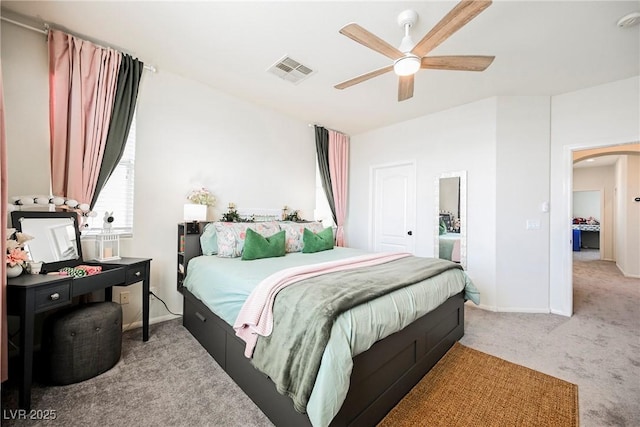 carpeted bedroom with ceiling fan