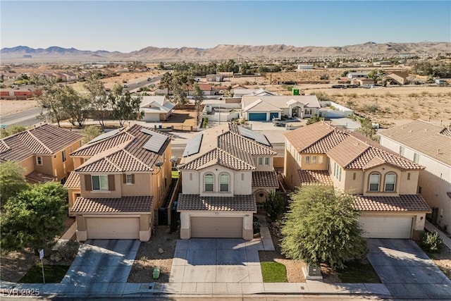 birds eye view of property with a mountain view