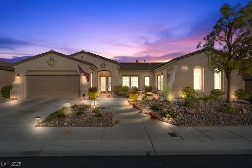 mediterranean / spanish-style house featuring a garage