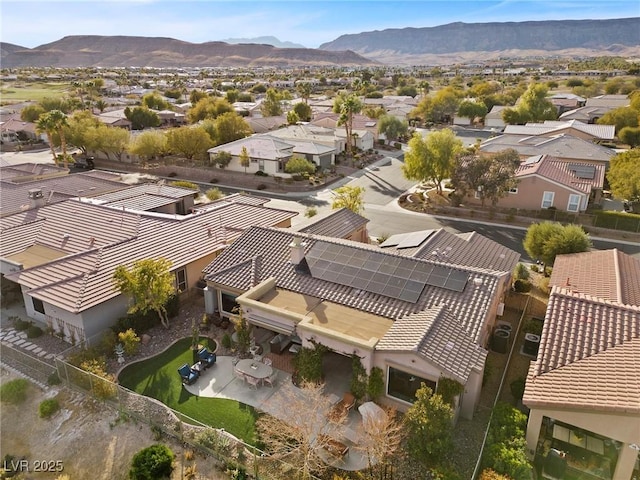 birds eye view of property featuring a mountain view