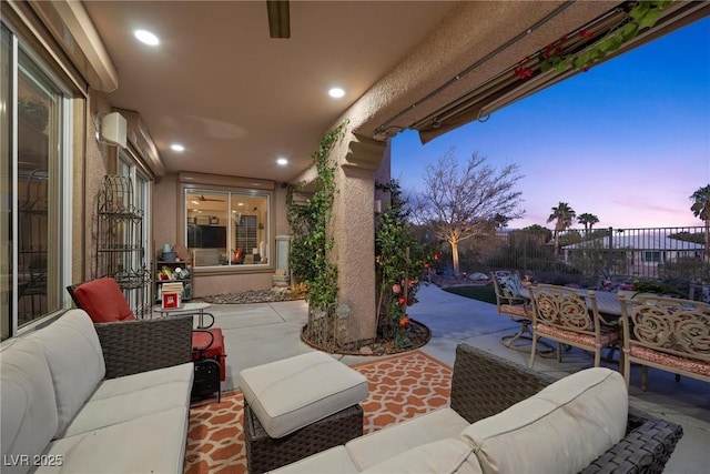 patio terrace at dusk with outdoor lounge area