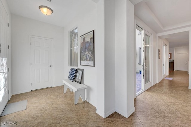 hallway with light tile patterned floors