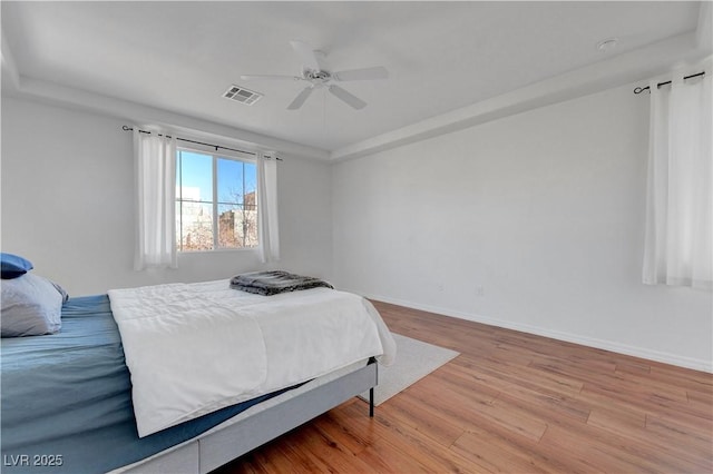 bedroom featuring light wood-type flooring and ceiling fan