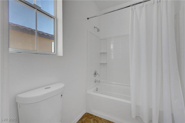 bathroom with tile patterned floors, toilet, shower / tub combo, and a healthy amount of sunlight