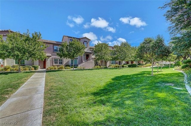 view of property's community with a yard