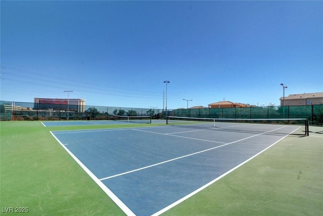 view of sport court with basketball hoop