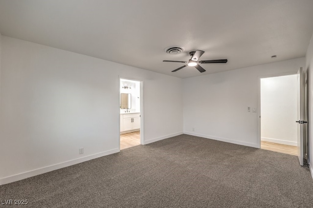 carpeted empty room with ceiling fan