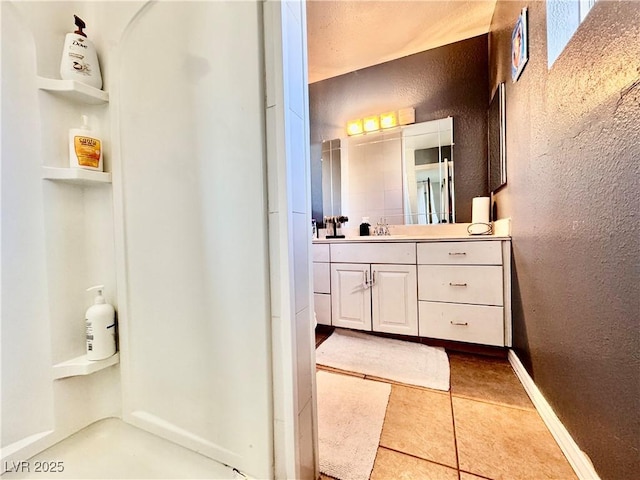 bathroom featuring vanity and tile patterned flooring