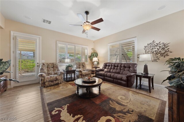 10372 Hawks Wing St, Las Vegas, NV 89178 - living room with ceiling fan and light hardwood / wood-style floors
