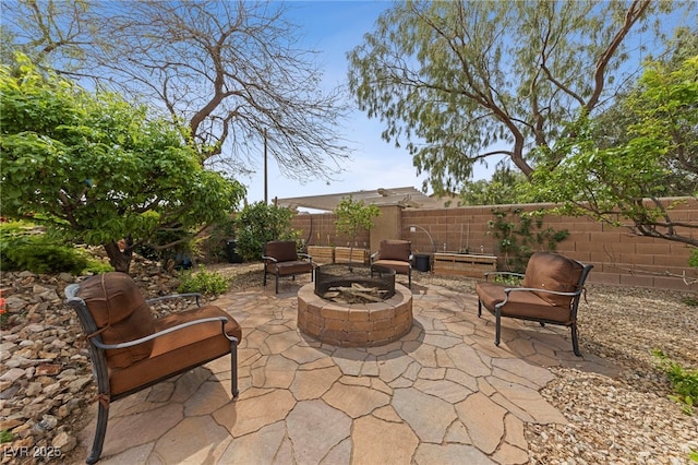 10372 Hawks Wing St, Las Vegas, NV 89178 - view of patio featuring an outdoor fire pit