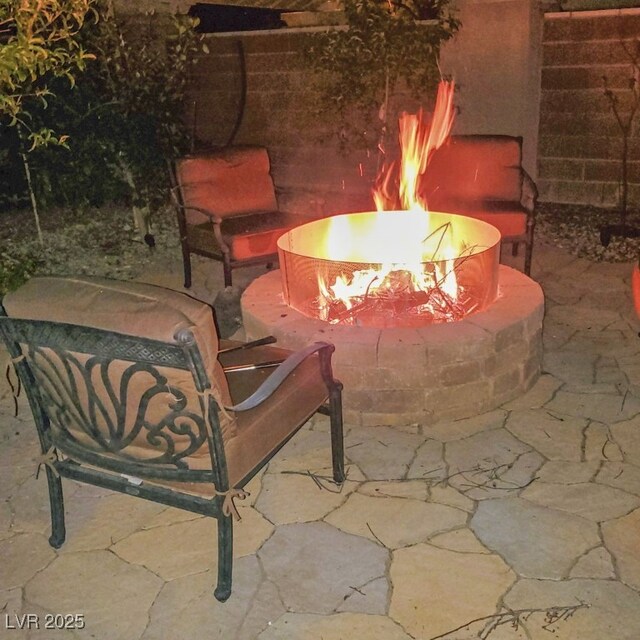 view of patio featuring an outdoor fire pit