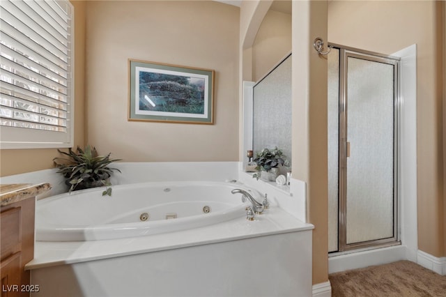 bathroom with vanity and separate shower and tub