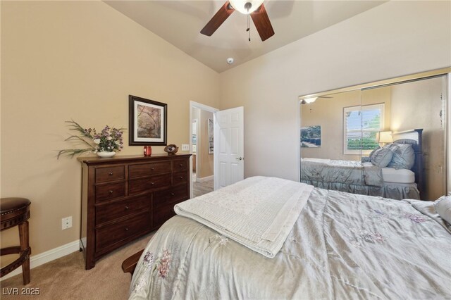 bedroom featuring vaulted ceiling, ceiling fan, and light colored carpet