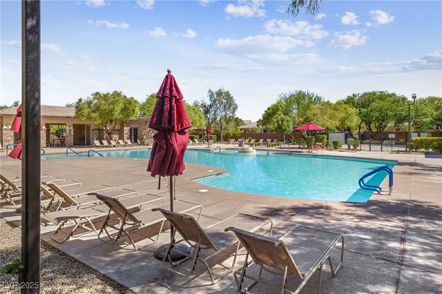 view of swimming pool with a patio area