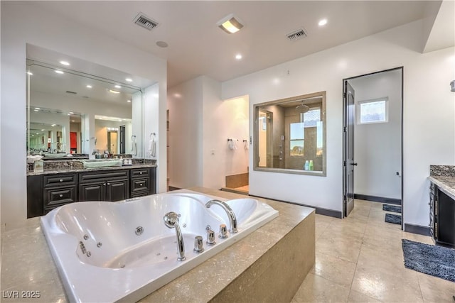 bathroom with separate shower and tub and vanity