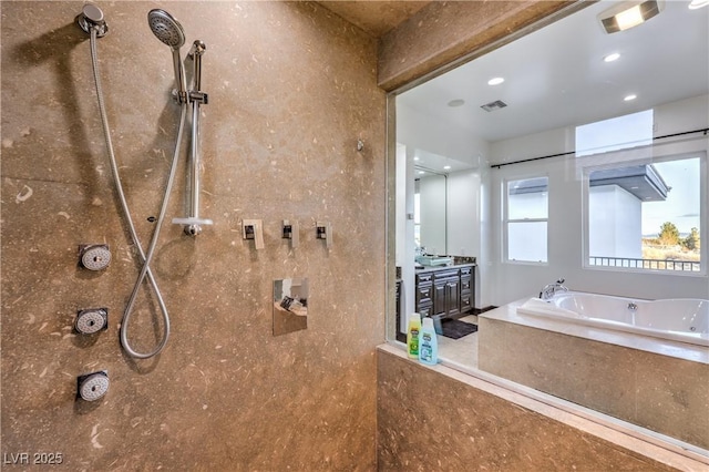 bathroom featuring vanity and separate shower and tub