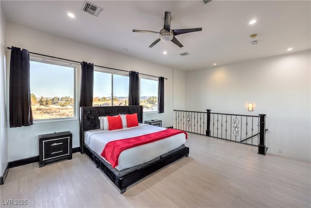 bedroom featuring ceiling fan and light hardwood / wood-style floors