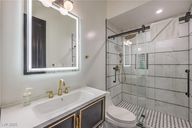 bathroom with toilet, an enclosed shower, and vanity