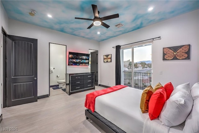 bedroom featuring ceiling fan, access to exterior, ensuite bath, and light wood-type flooring