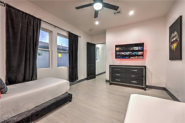 bedroom featuring ceiling fan and light hardwood / wood-style flooring