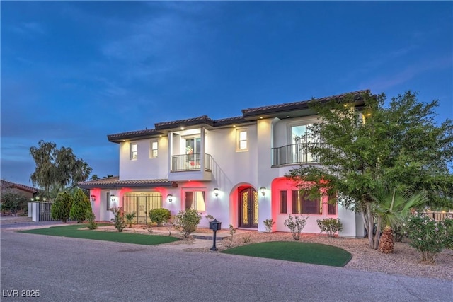 mediterranean / spanish-style house featuring a balcony