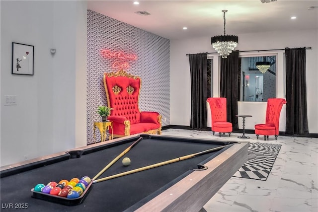 playroom with an inviting chandelier and pool table