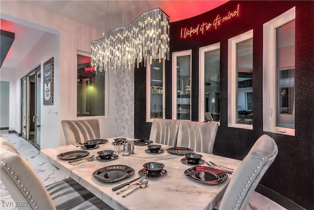 dining area featuring an inviting chandelier