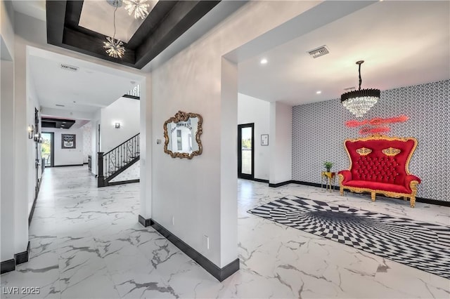 hallway featuring a notable chandelier