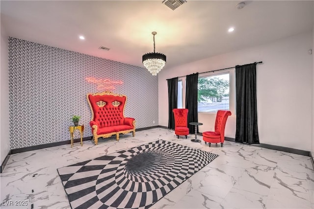 living area featuring an inviting chandelier