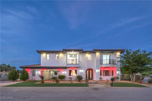 mediterranean / spanish-style home with a balcony