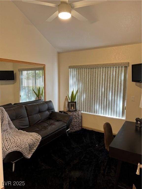 living room featuring vaulted ceiling and ceiling fan