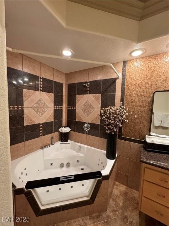 bathroom featuring tile walls, tiled shower / bath combo, ornamental molding, and tile patterned flooring