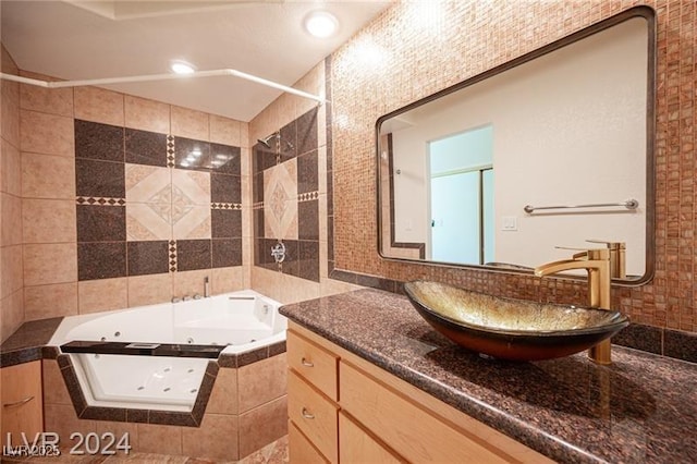 bathroom featuring separate shower and tub and vanity