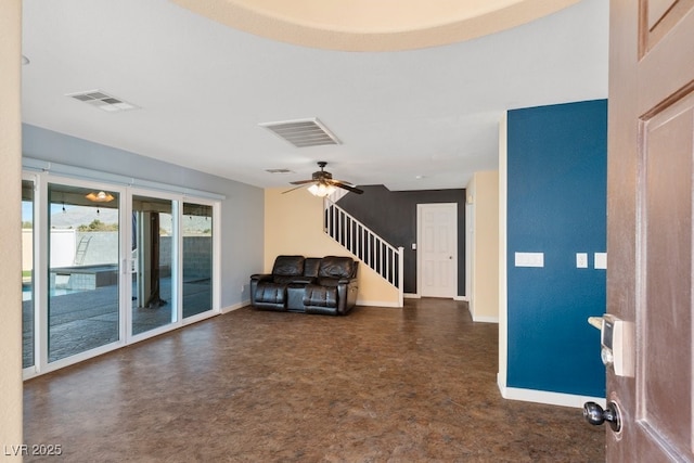 interior space with ceiling fan