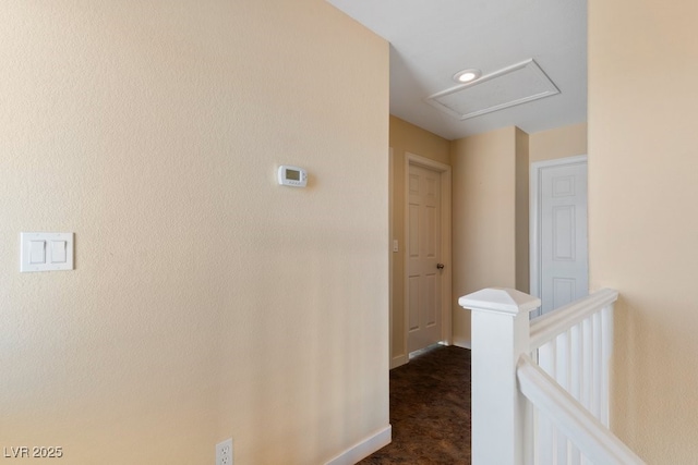 hallway with dark carpet