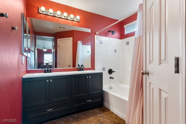 bathroom featuring vanity and shower / bathtub combination with curtain