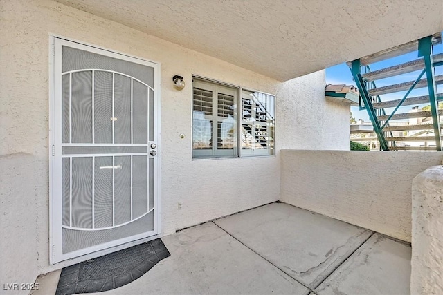 property entrance with a balcony