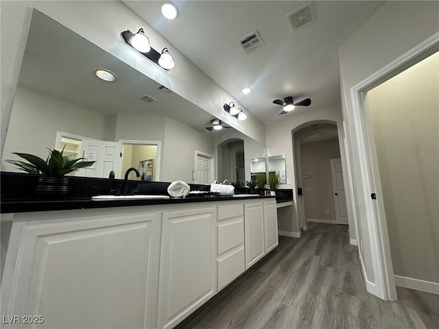 bathroom featuring hardwood / wood-style floors and vanity