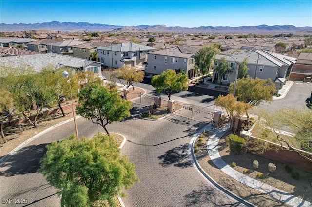 birds eye view of property with a mountain view