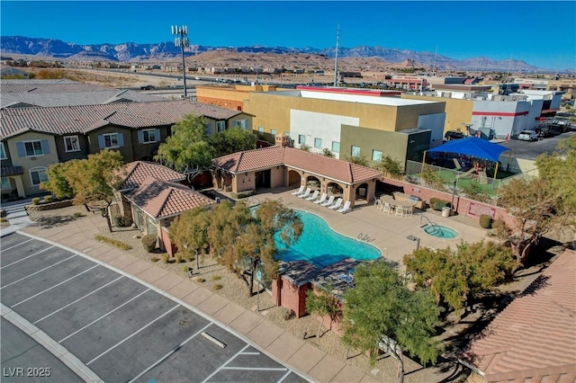 birds eye view of property with a mountain view