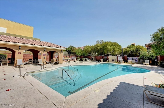 view of swimming pool with a patio