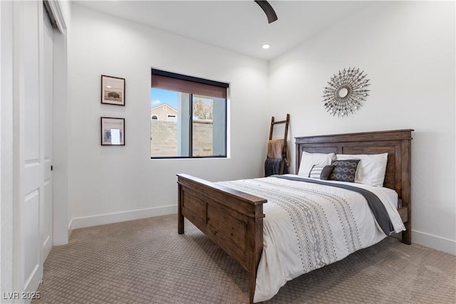 carpeted bedroom featuring a closet and ceiling fan