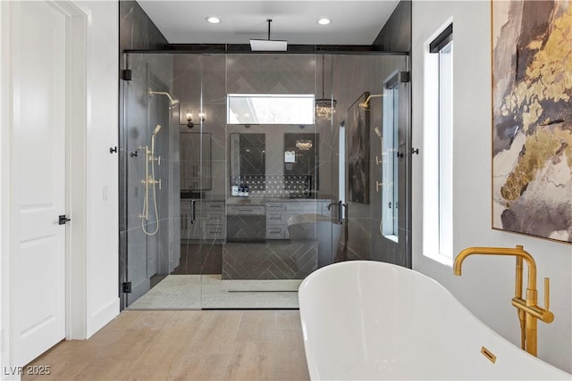 bathroom with separate shower and tub