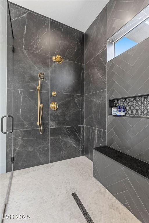 bathroom with a shower with shower door