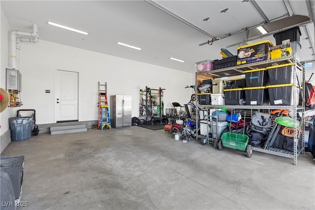 garage featuring stainless steel fridge