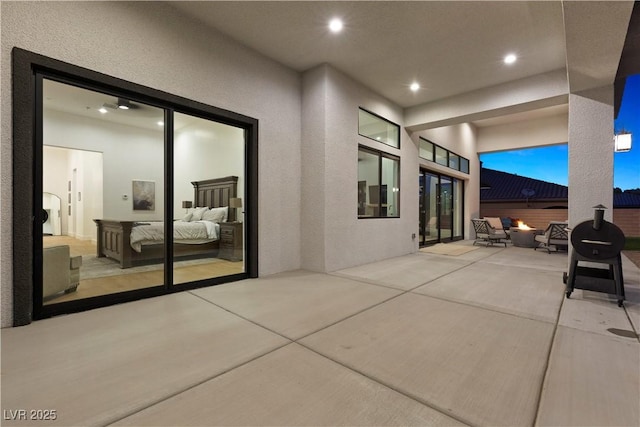 view of patio / terrace featuring an outdoor fire pit