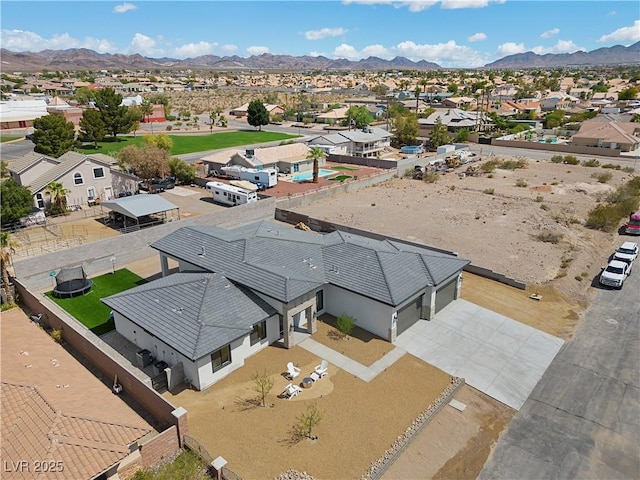 birds eye view of property with a mountain view